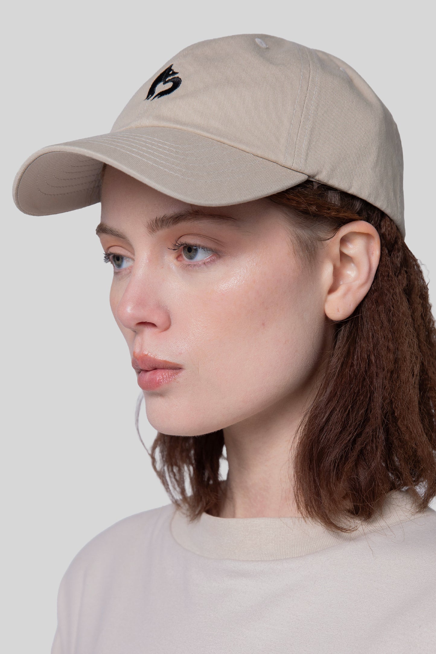 Angled view of oak No Cap hat, low profile fit
