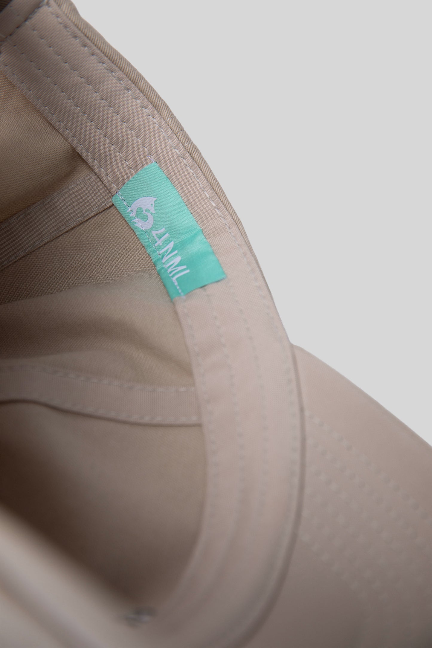 Interior detail of No Cap hat showing inner tag and stitching
