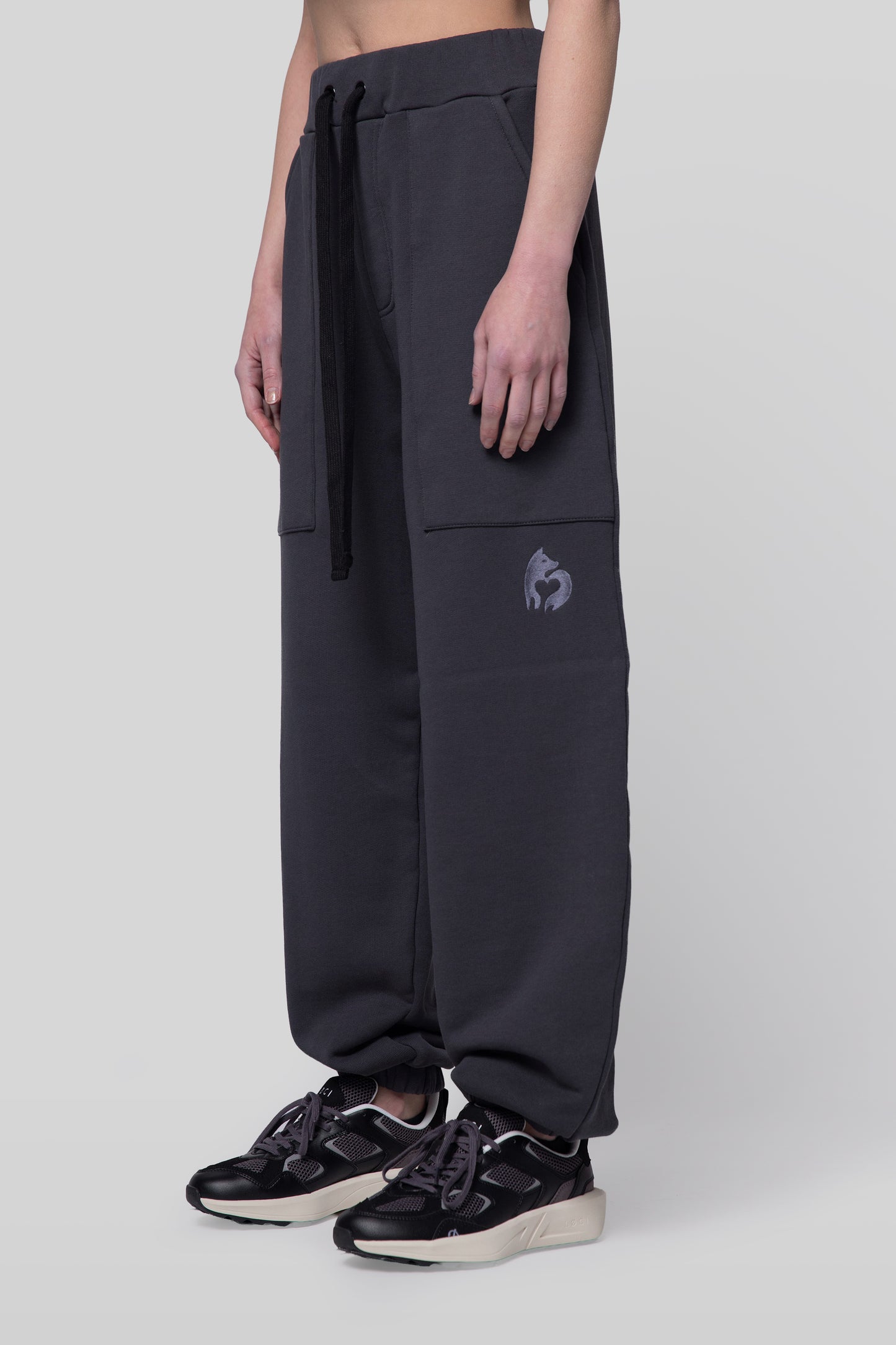 Angled view of deep grey No Sweat pants, relaxed fit