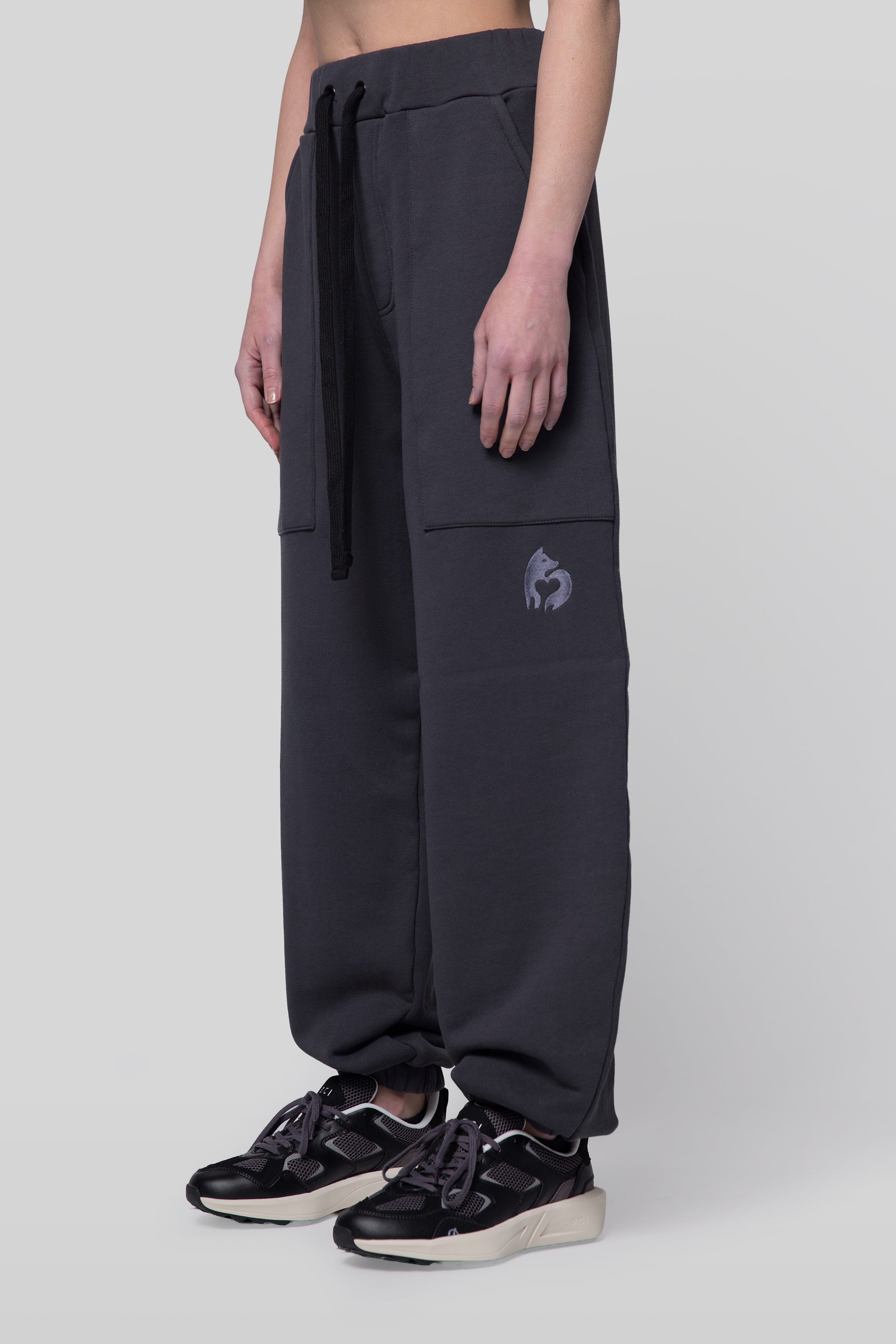 Angled view of deep grey No Sweat pants, relaxed fit