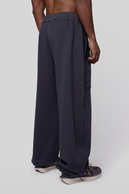 Back angled view of No Sweat pants in deep grey organic cotton