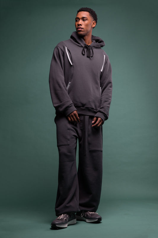 Full body view of No Sweat pants in deep grey organic cotton, relaxed silhouette