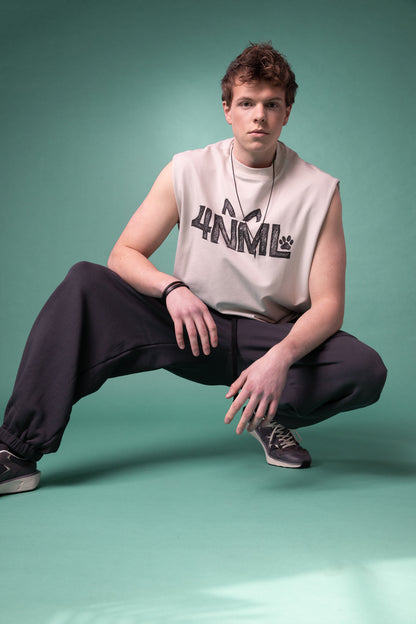 [card:men-primary][card:all-primary] Model wearing 4NML No Sweat pants in deep grey organic cotton with oversized pockets, relaxed fit
