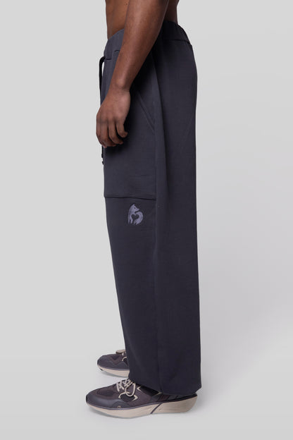 Side profile of No Sweat pants in deep grey organic cotton