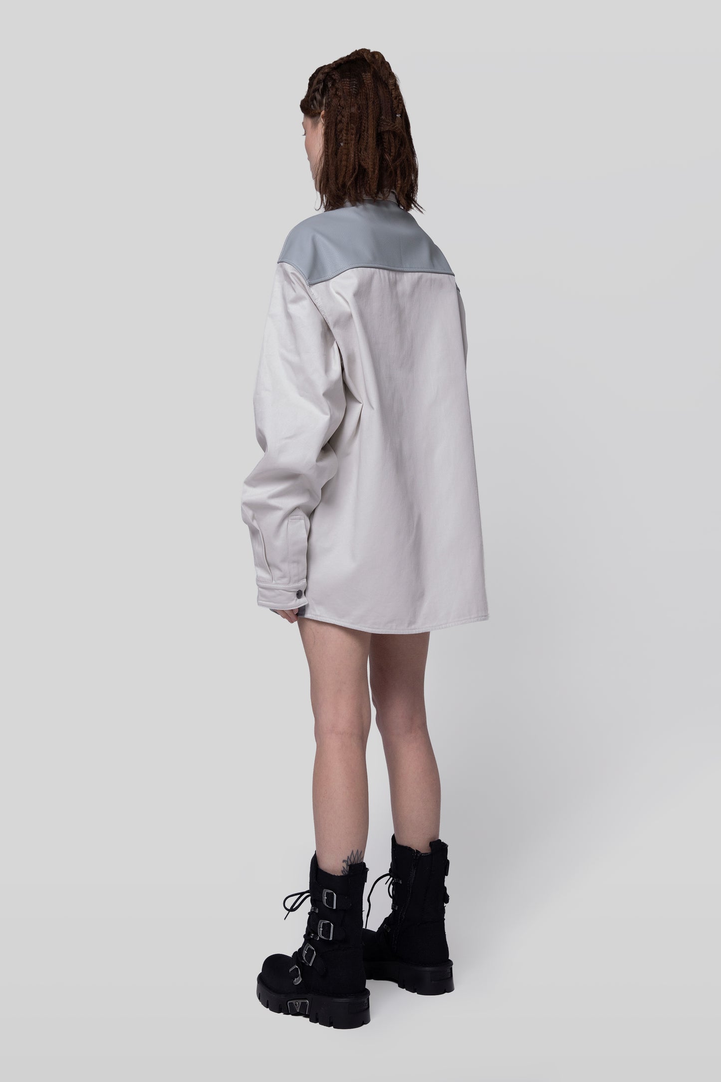 Angled back view of Out of Pocket shirt in light grey