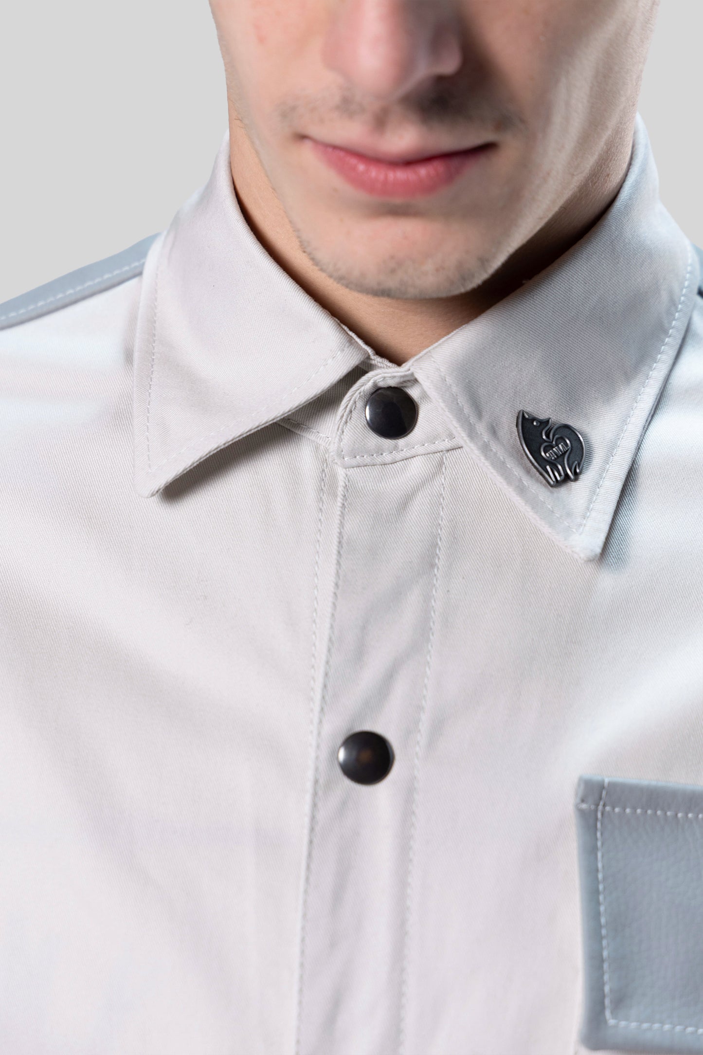 Close-up of collar with silver 4NML logo pin on Out of Pocket shirt