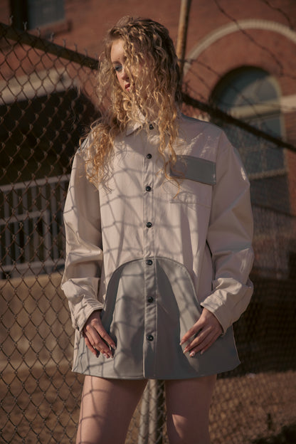 [card:women-primary][card:all-primary] Model wearing 4NML Out of Pocket shirt in light grey cotton with AppleSkin pouch pocket and panel, relaxed fit