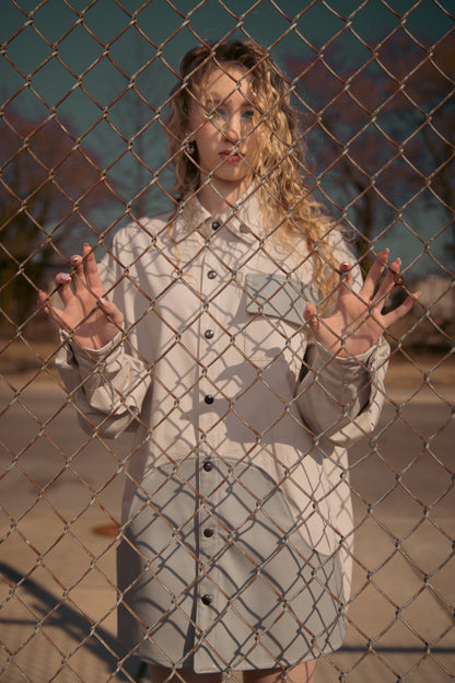 Model wearing Out of Pocket shirt in light grey with structured collar