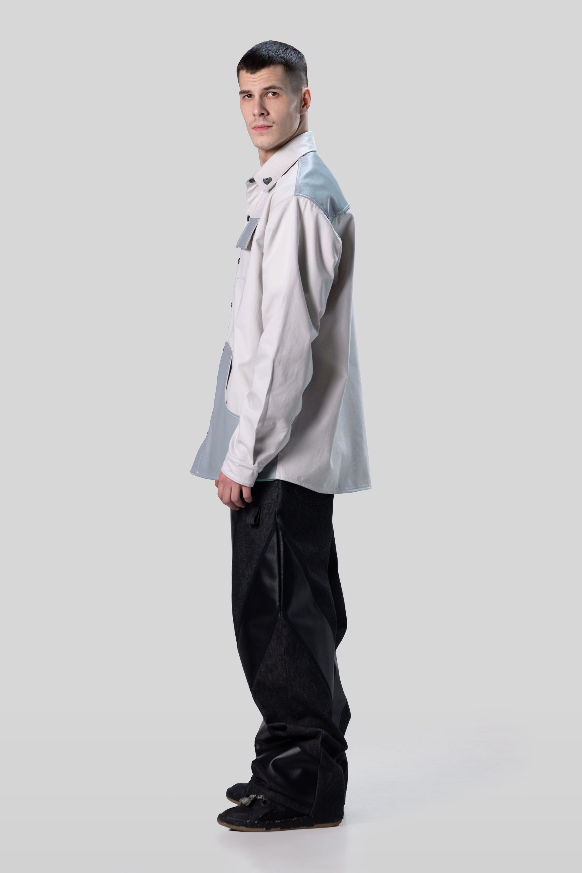 Side profile of Out of Pocket shirt in light grey with relaxed drape