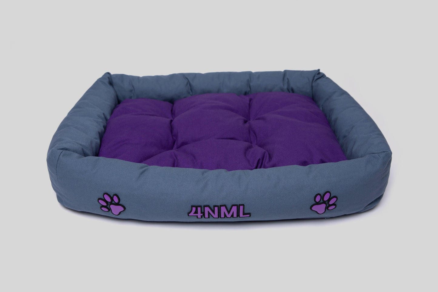 Angled view of canvas cotton pet bed with lavender AppleSkin embroidery, blue and purple
