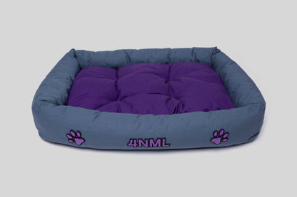 Angled view of canvas cotton pet bed with lavender AppleSkin embroidery, blue and purple