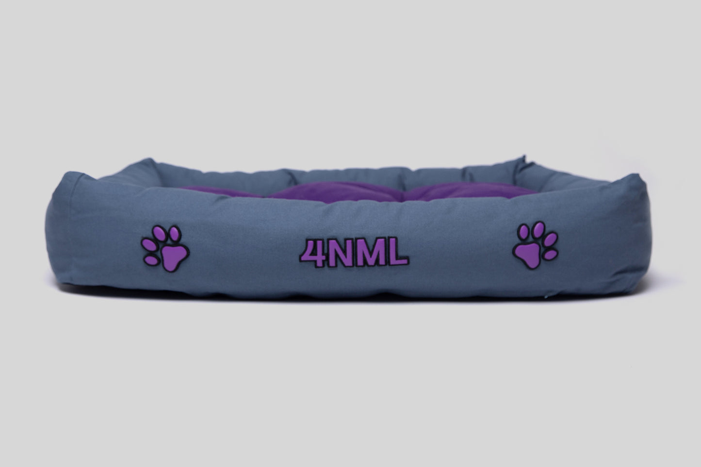 Side view of canvas cotton pet bed with lavender AppleSkin embroidery, blue base