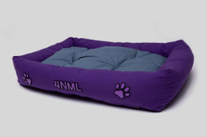 Angled view of canvas cotton pet bed with lavender AppleSkin embroidery, purple base with blue cushion
