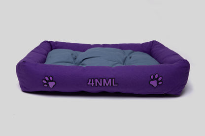 Top angled view of canvas cotton pet bed with tufted cushion, purple and blue colorway