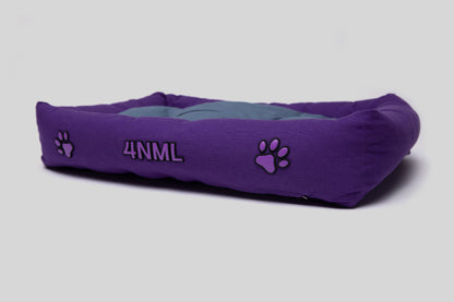 Low angled view of canvas cotton pet bed with lavender AppleSkin embroidery, purple base