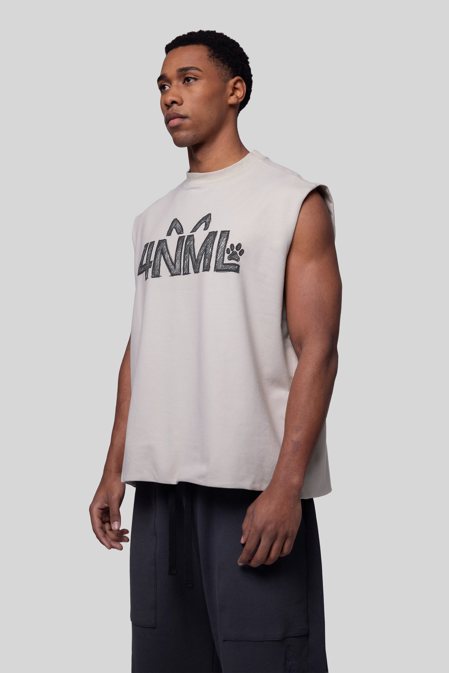 Angled view of Rough Draft tank with relaxed sleeveless fit