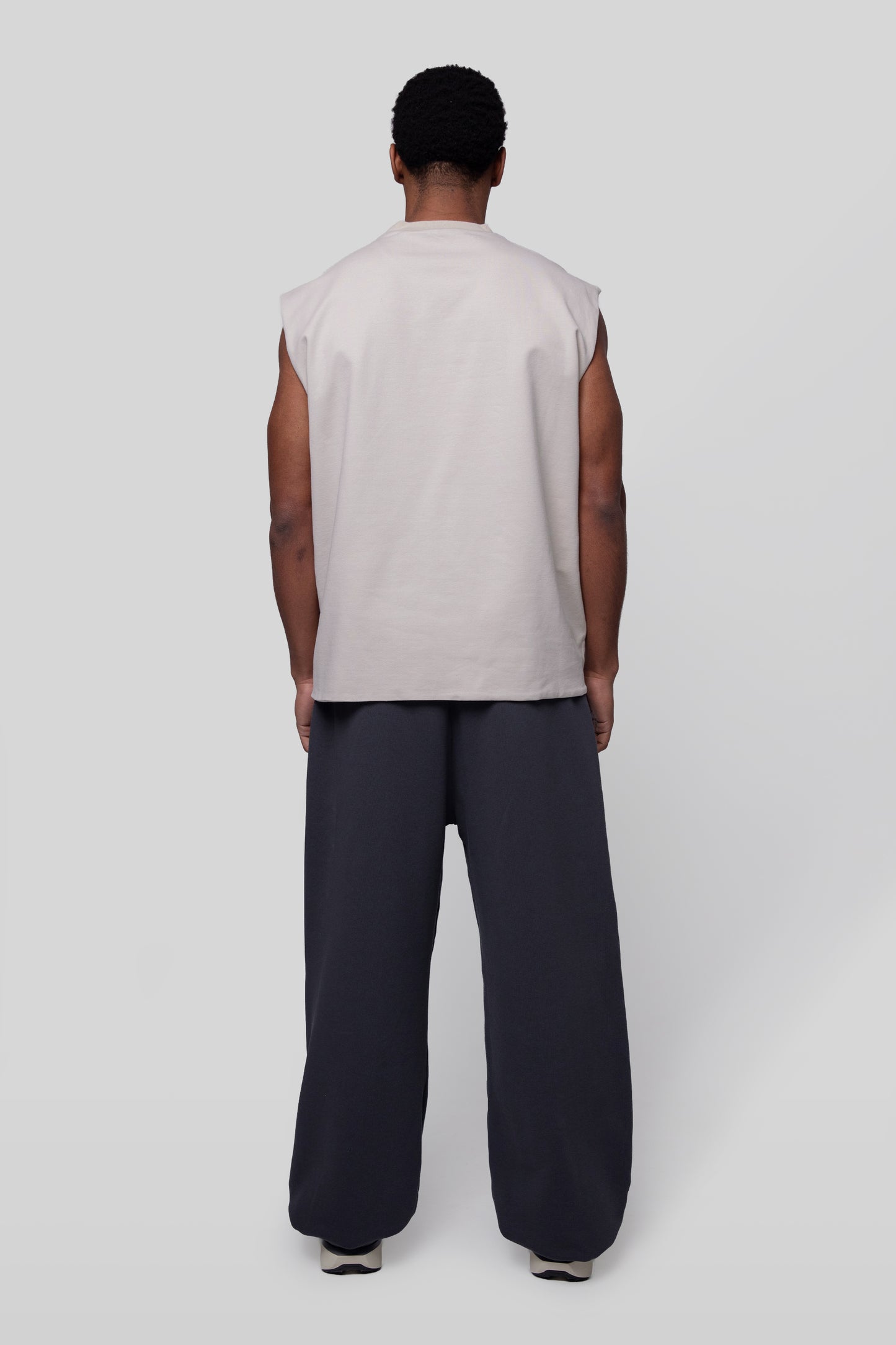Back full view of off-white Rough Draft tank, sleeveless construction