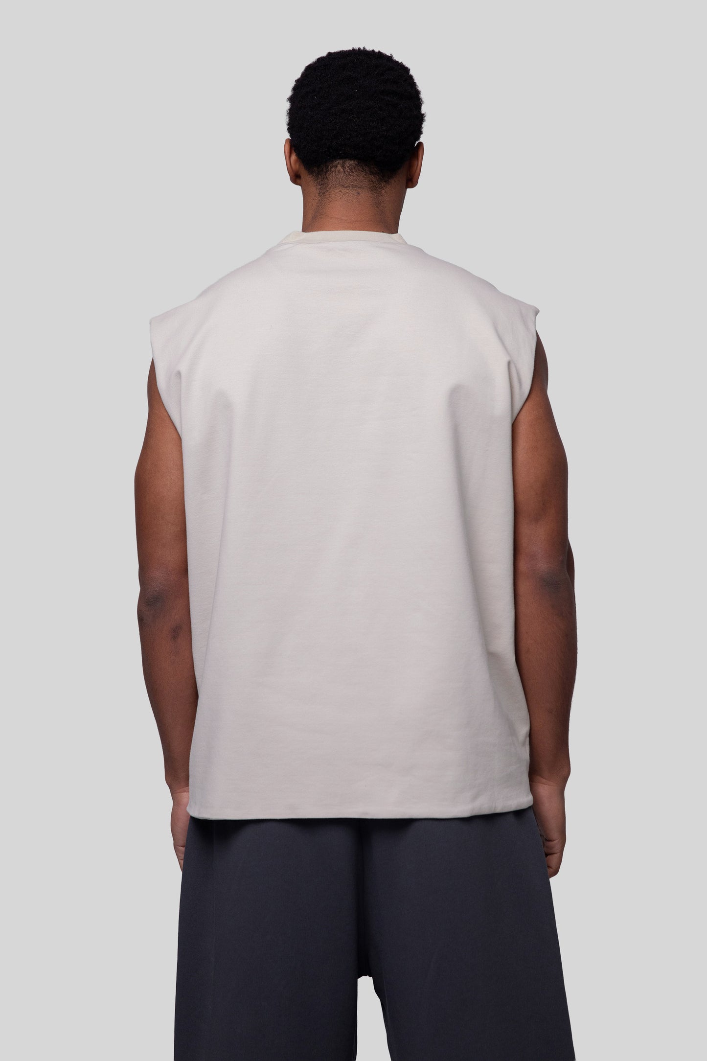Back view of off-white Rough Draft tank, clean finish