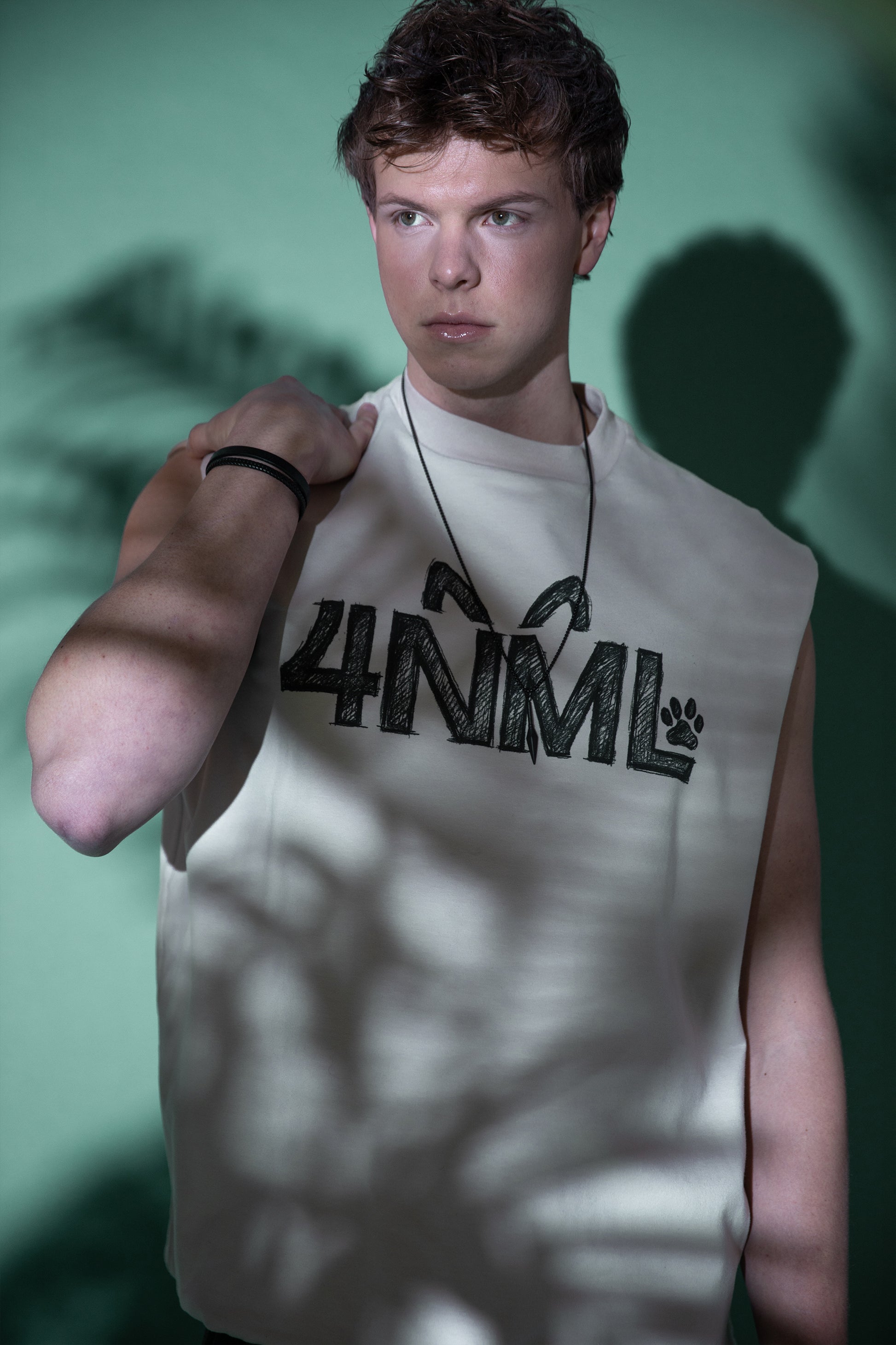 [card:men-primary][card:all-primary] Model wearing 4NML Rough Draft tank in off-white organic cotton with sketch DTG print