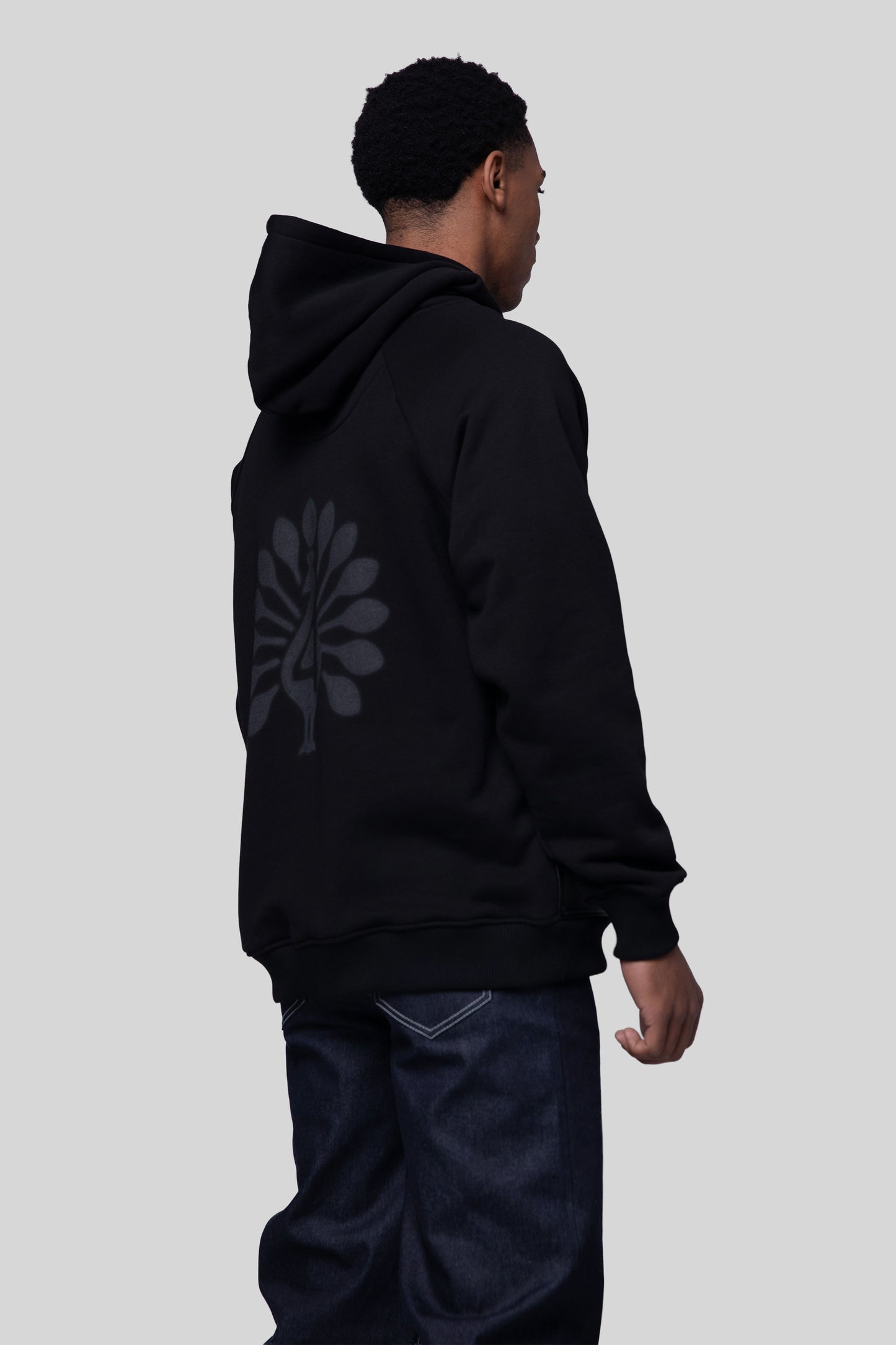 Angled back view of Shadow hoodie in black