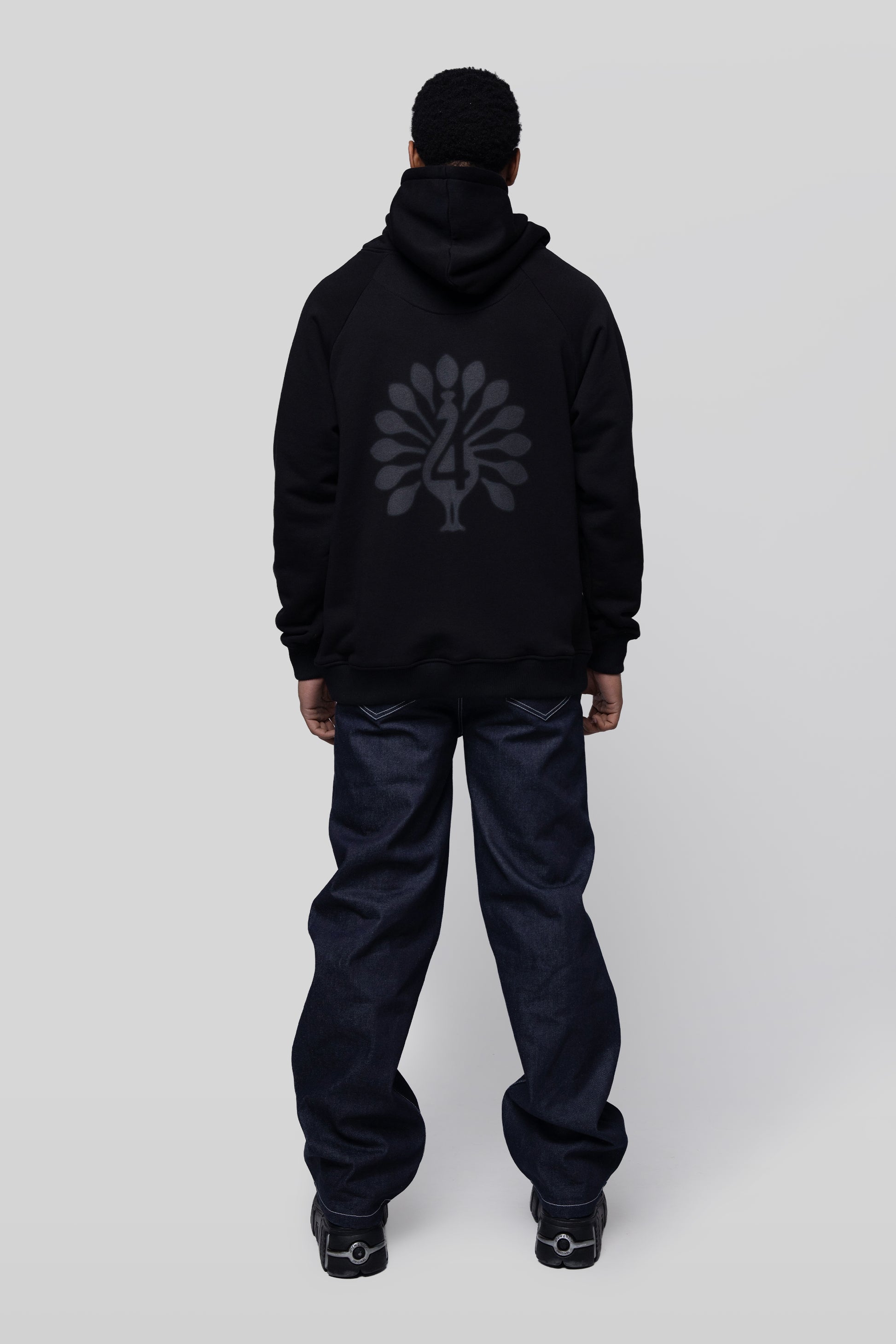 Full body back view of Shadow hoodie with peahen print