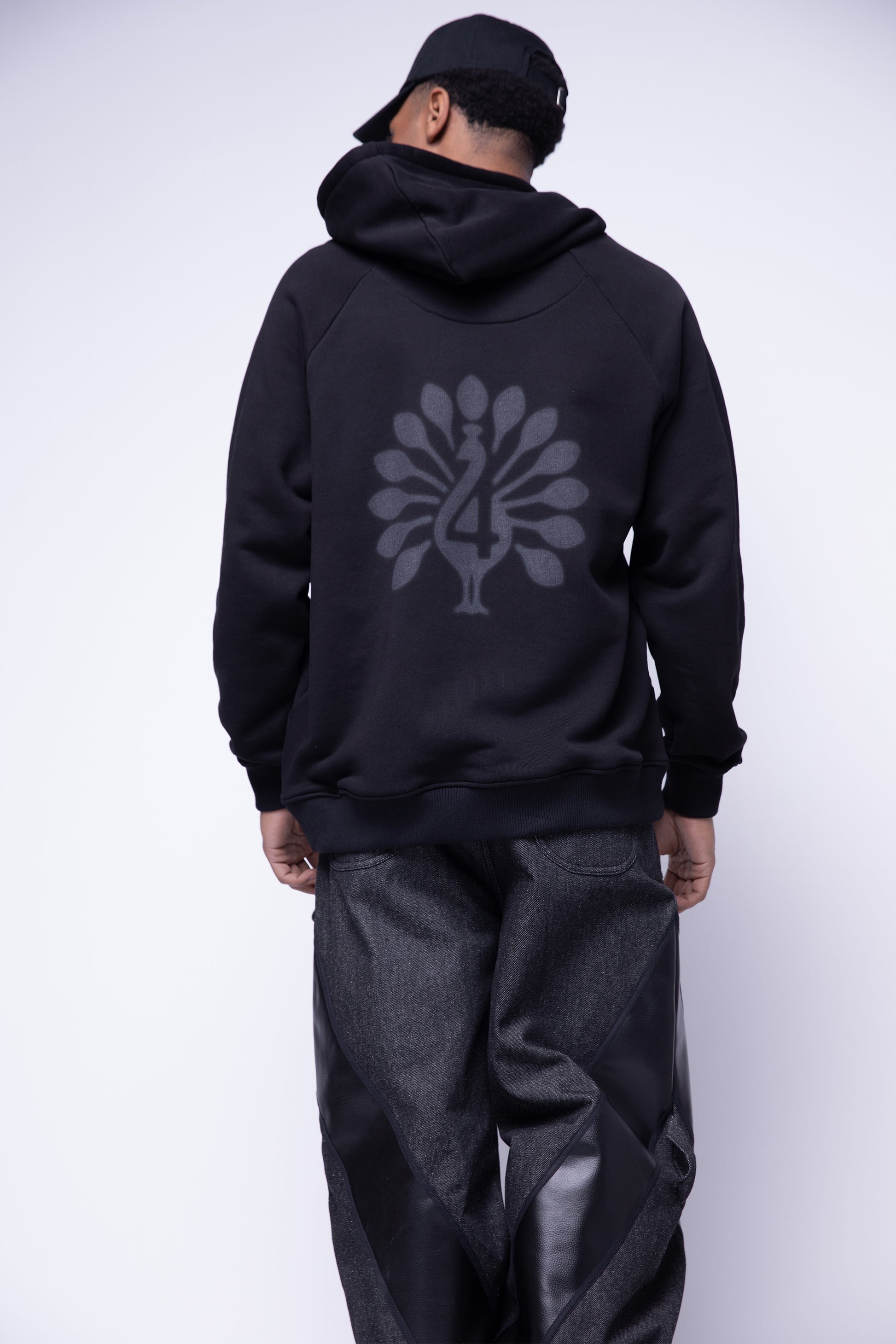 [card:men-primary][card:all-secondary] Back view of Shadow hoodie showing peahen graphic