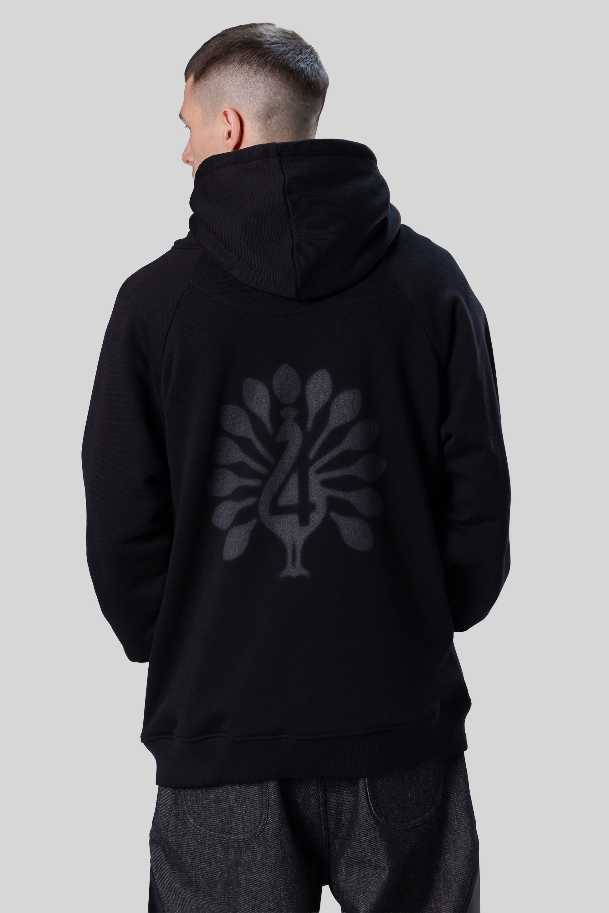 Back view of Shadow hoodie with peahen print