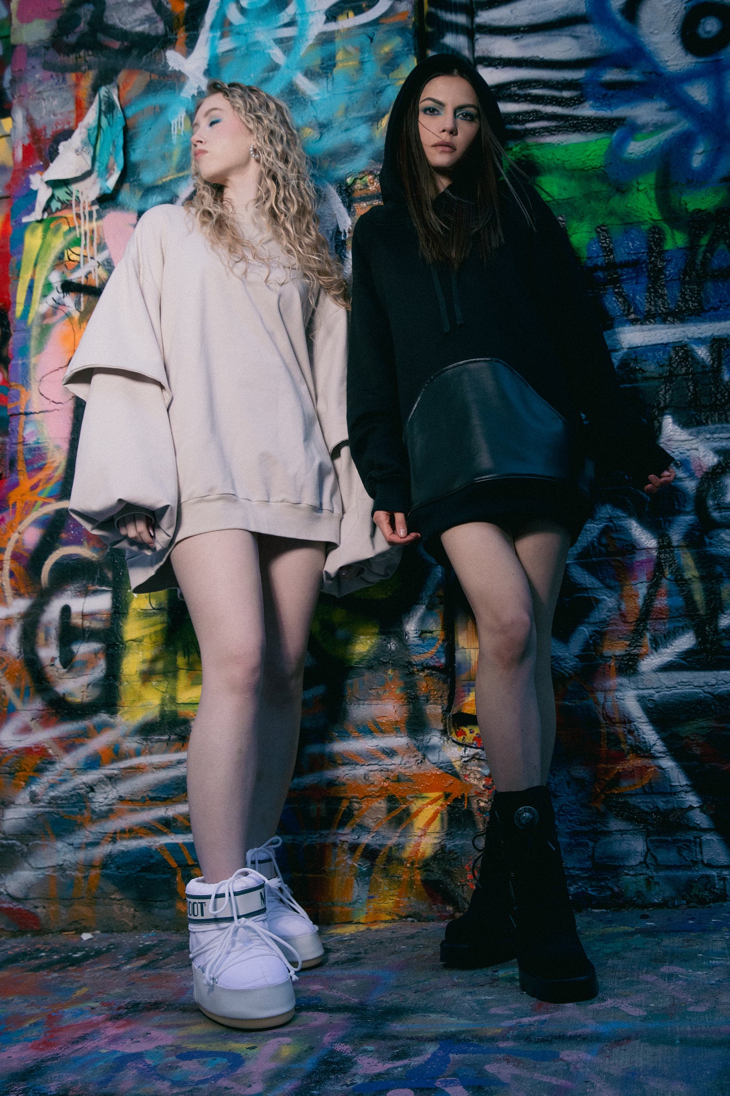 Models wearing Shadow hoodie in black, styled look