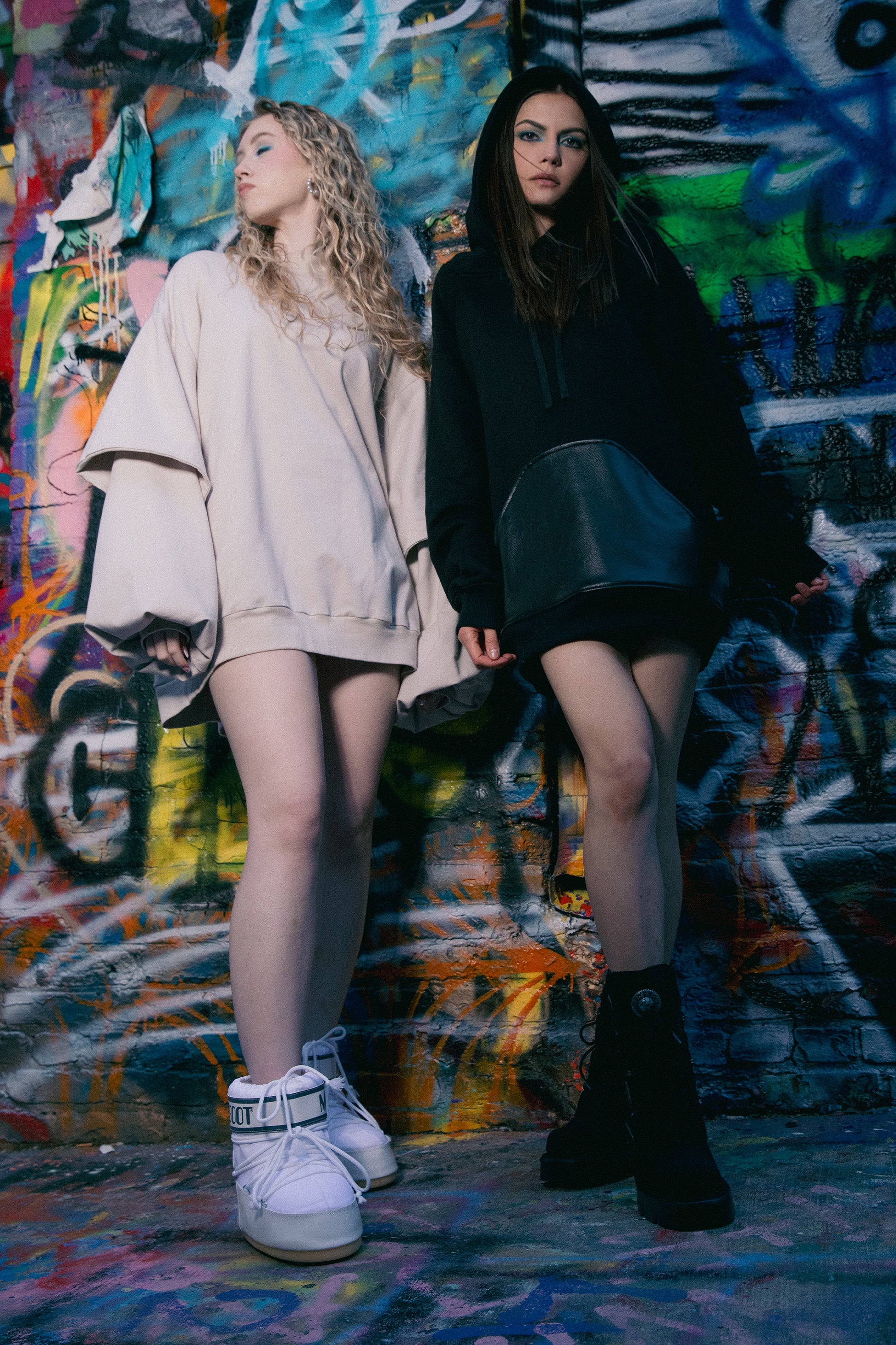 Models wearing Shadow hoodie in black, styled look