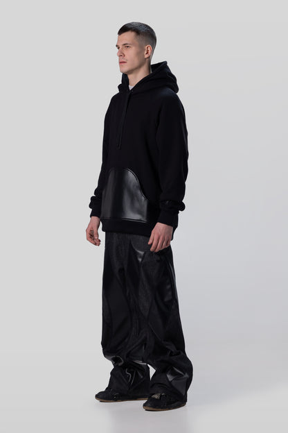 Angled side view of Shadow hoodie in black