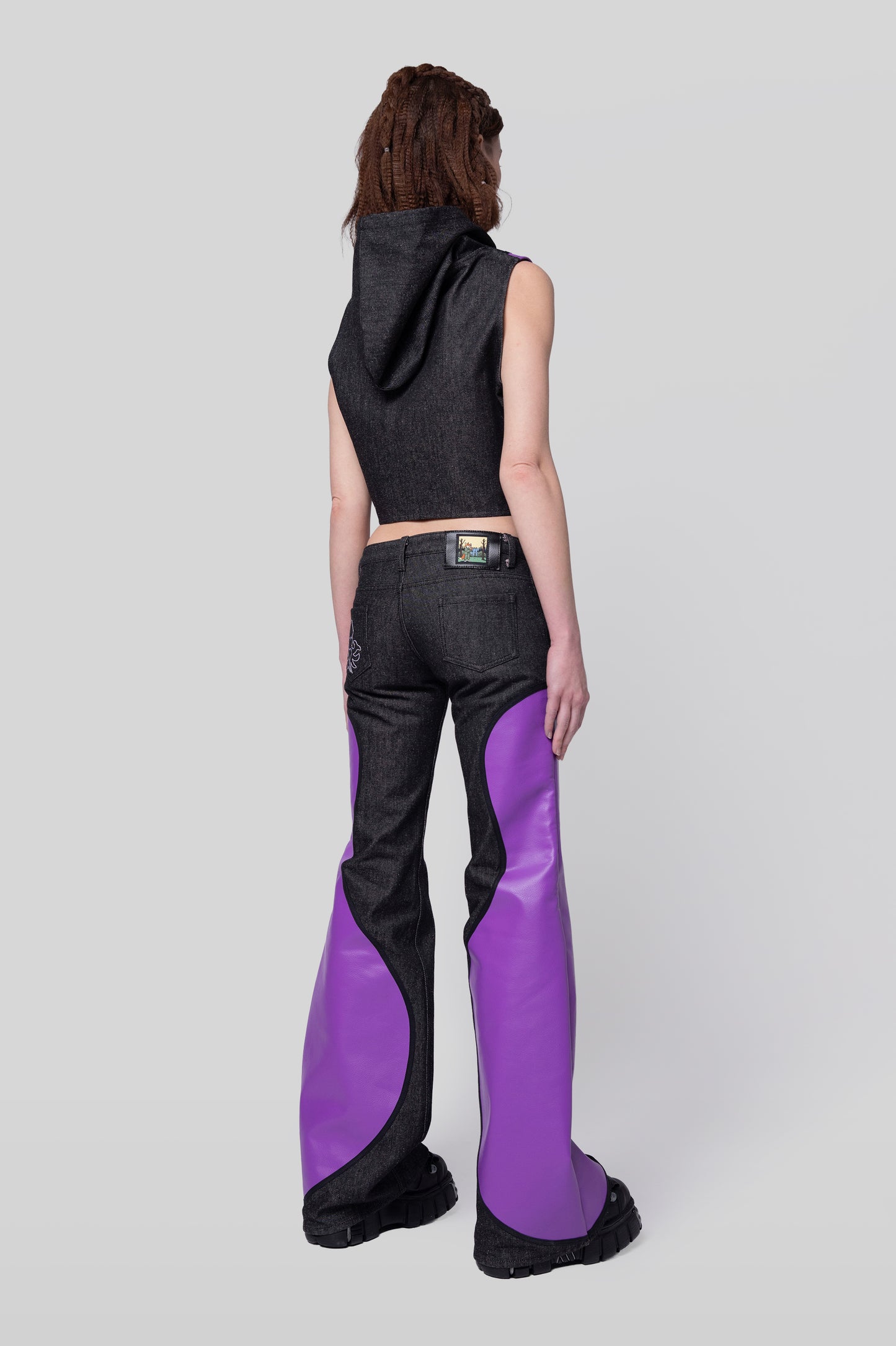 Back angled right view of Squid jeans showing panel construction