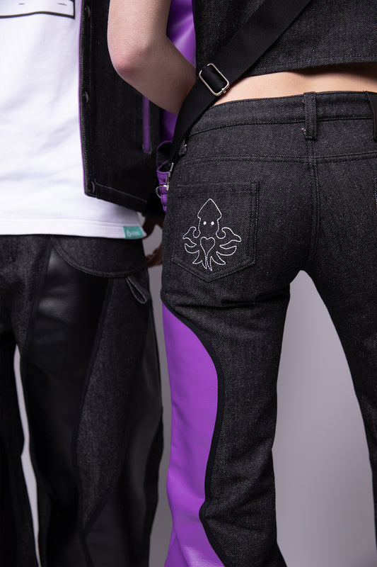 Close-up of squid embroidery on back pocket of carbon Squid jeans