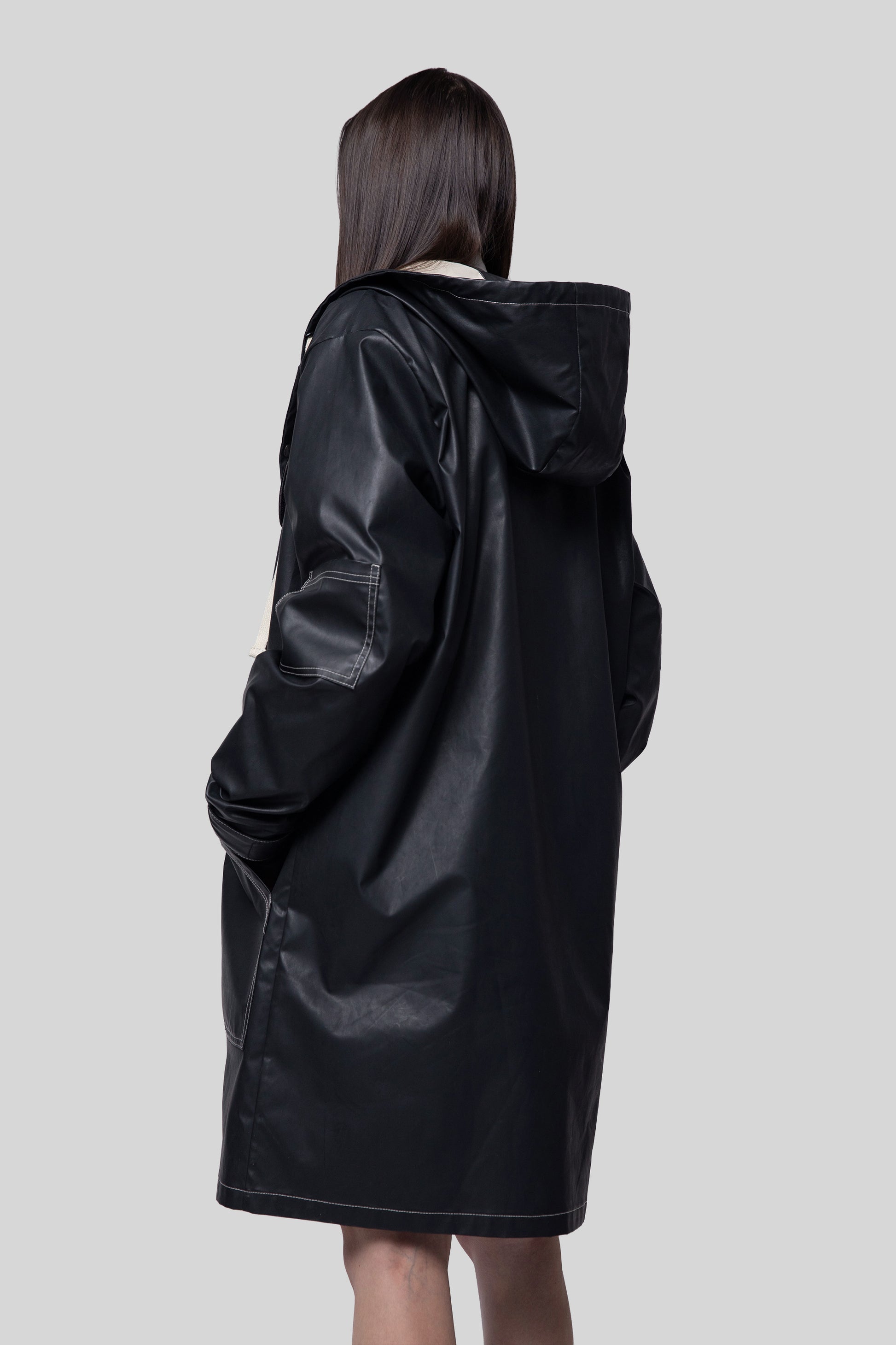 Back angled view of Totem coat in waterproof fabric