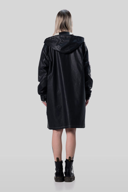 Back view of Totem coat in dark grey, long silhouette