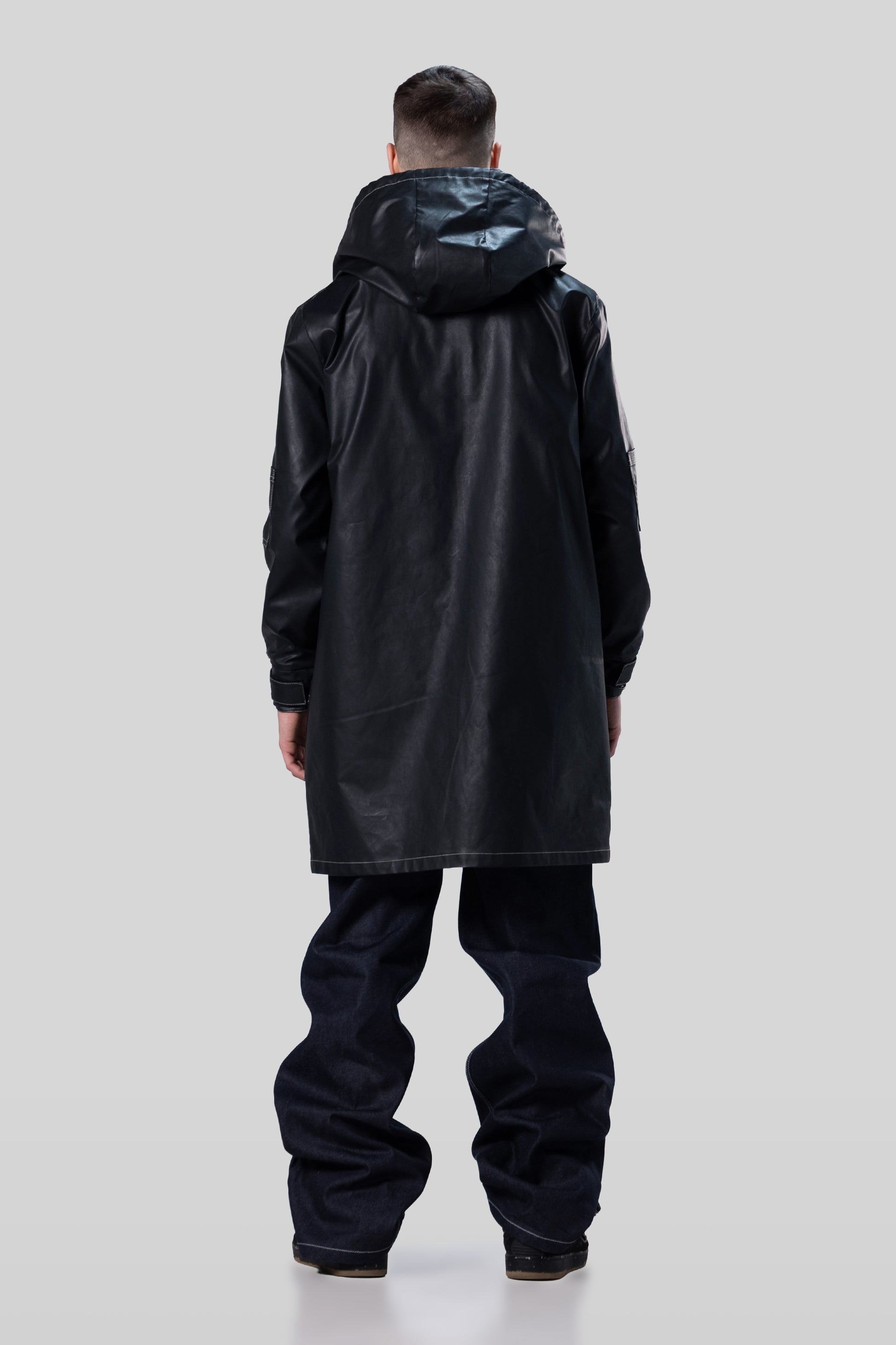 Back view of Totem coat in dark grey with hood