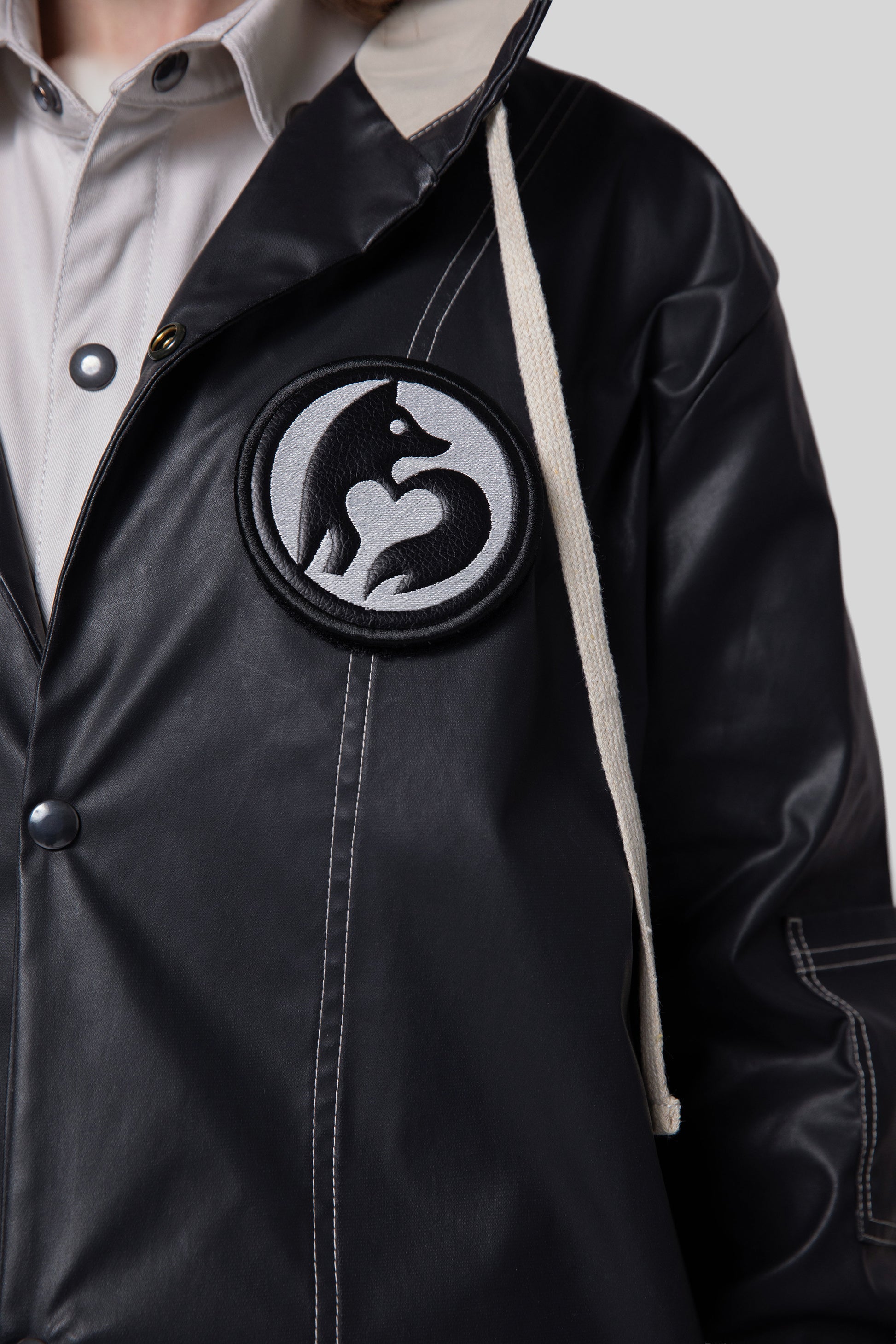 Close-up of removable animal badge on Totem coat