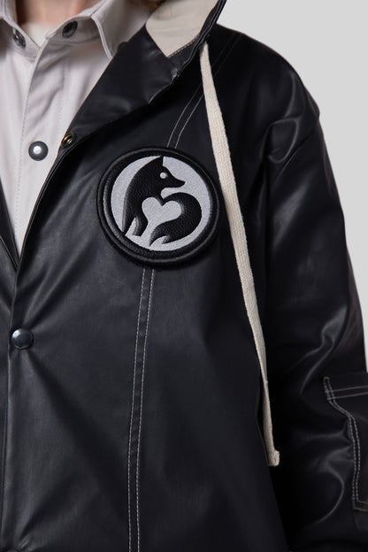 Close-up of removable animal badge on Totem coat