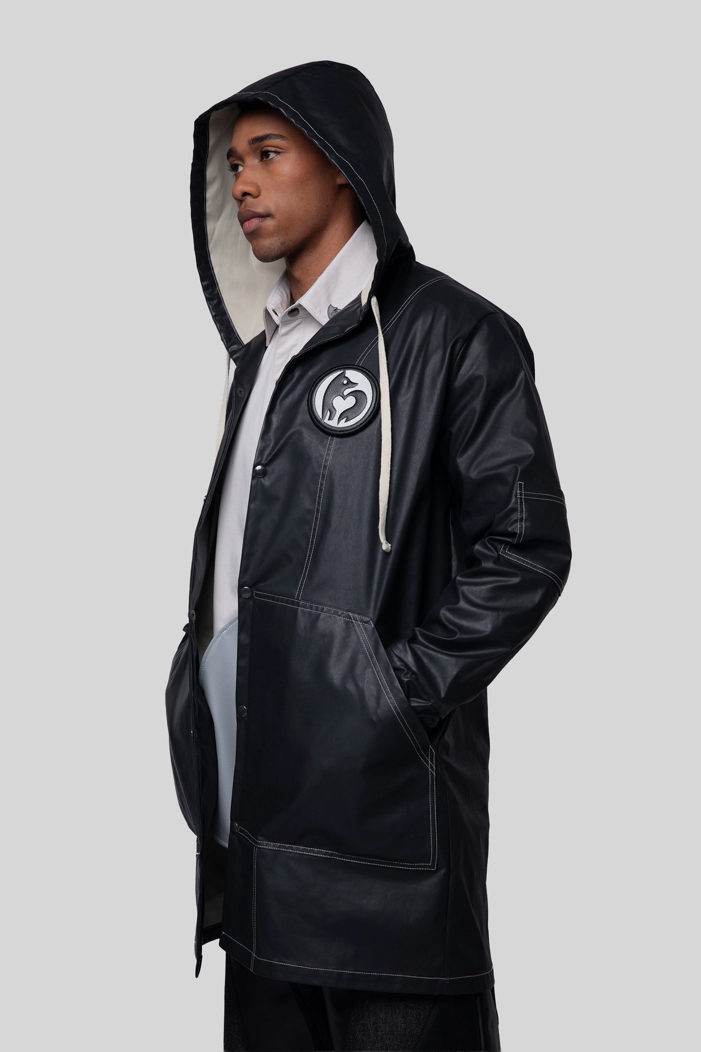 Front angled view of Totem coat in waterproof fabric