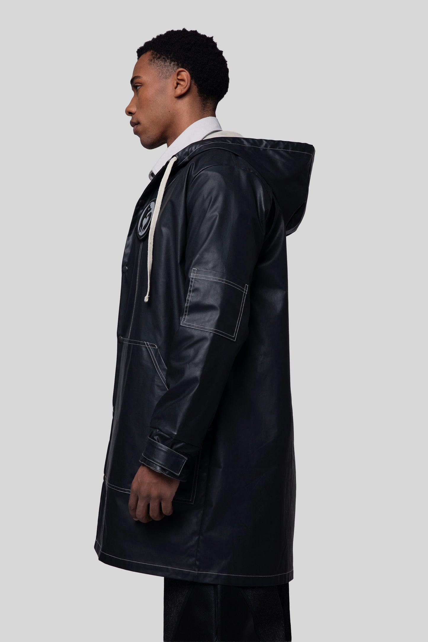 Cropped side view of Totem coat in dark grey