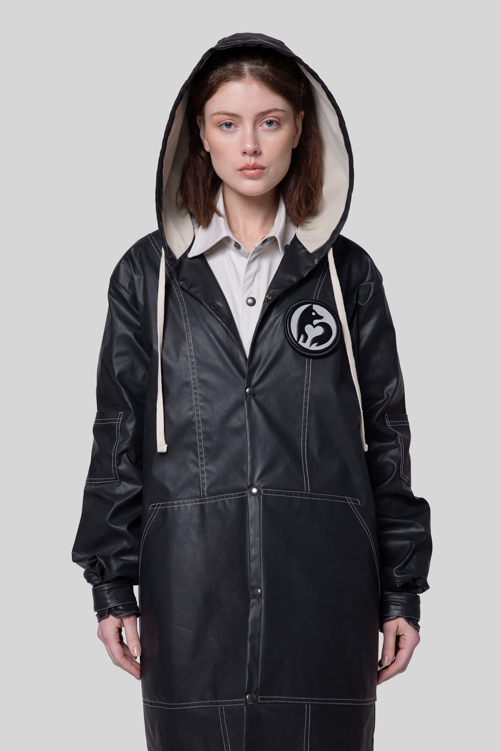 Front view of Totem coat in dark grey on model