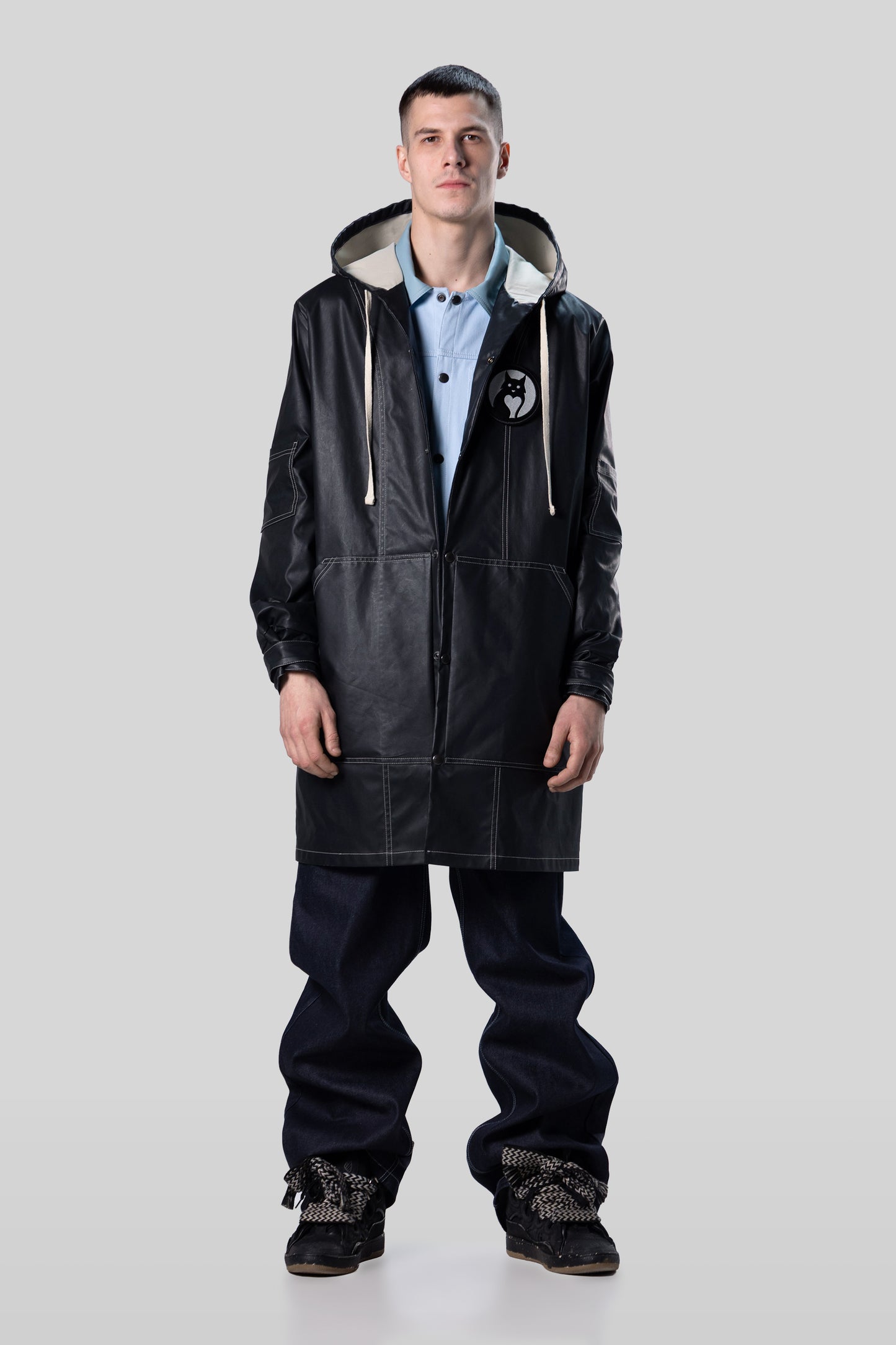 Full body view of Totem coat in dark grey waterproof material