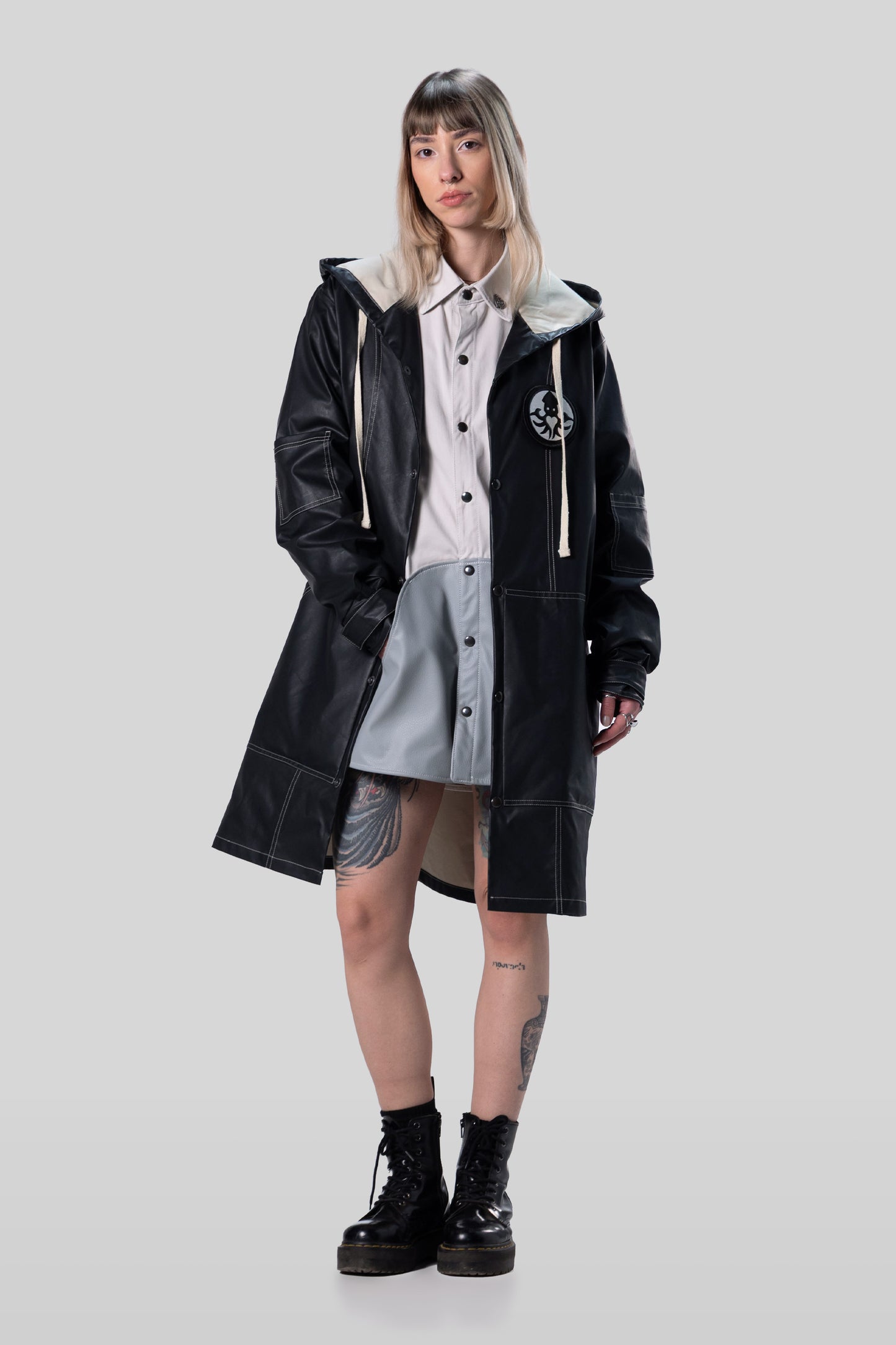 [card:women-primary] Model wearing Totem coat in dark grey with relaxed fit