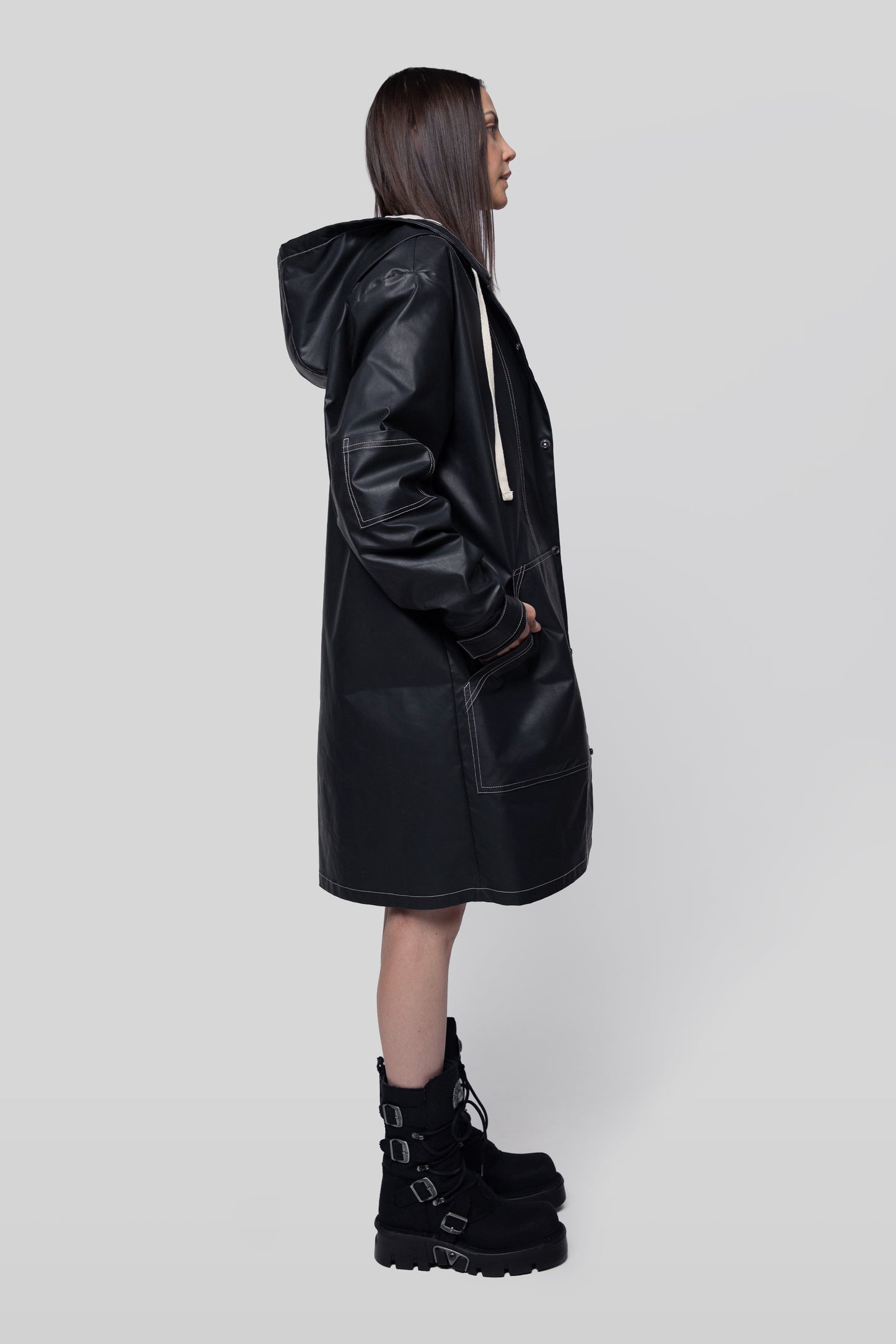 Side profile of Totem coat in dark grey waterproof fabric