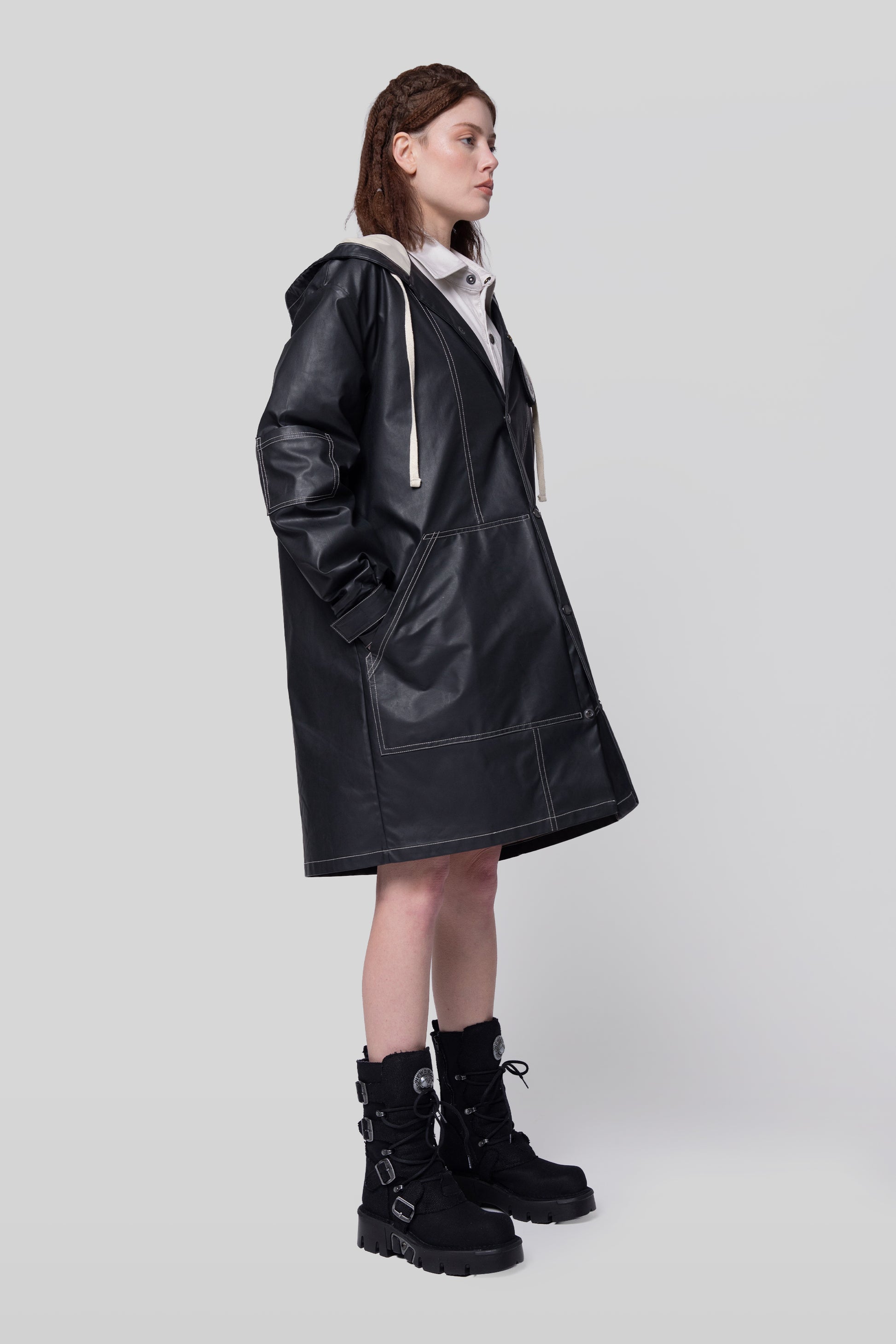 Side profile of Totem coat in dark grey with long silhouette