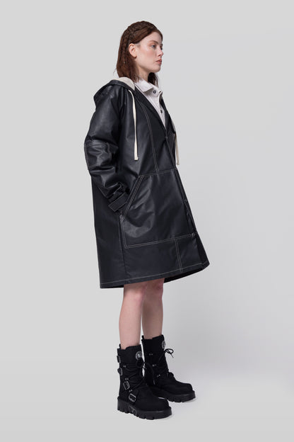 Side profile of Totem coat in dark grey with long silhouette