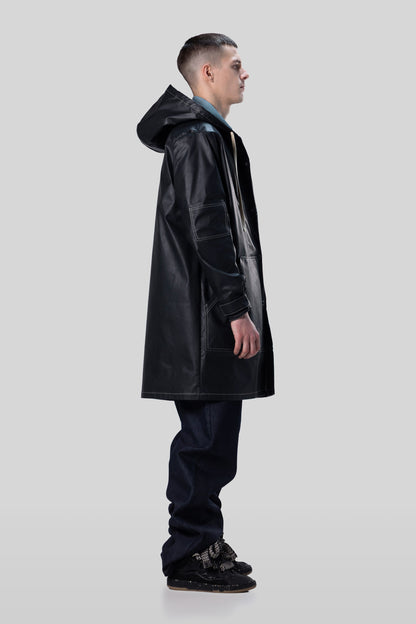 Side view of Totem coat in dark grey with structured hood