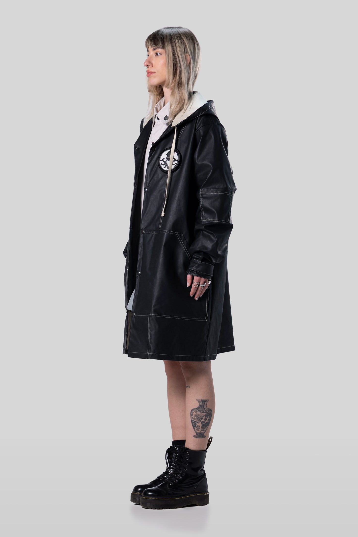 Side view of Totem coat with relaxed drape