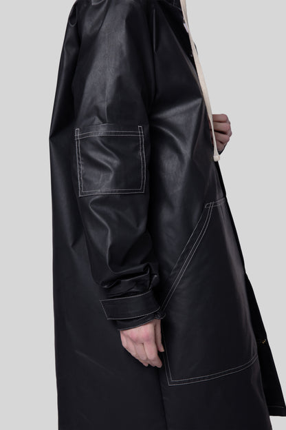 Close-up of sleeve and stitching on Totem coat in dark grey