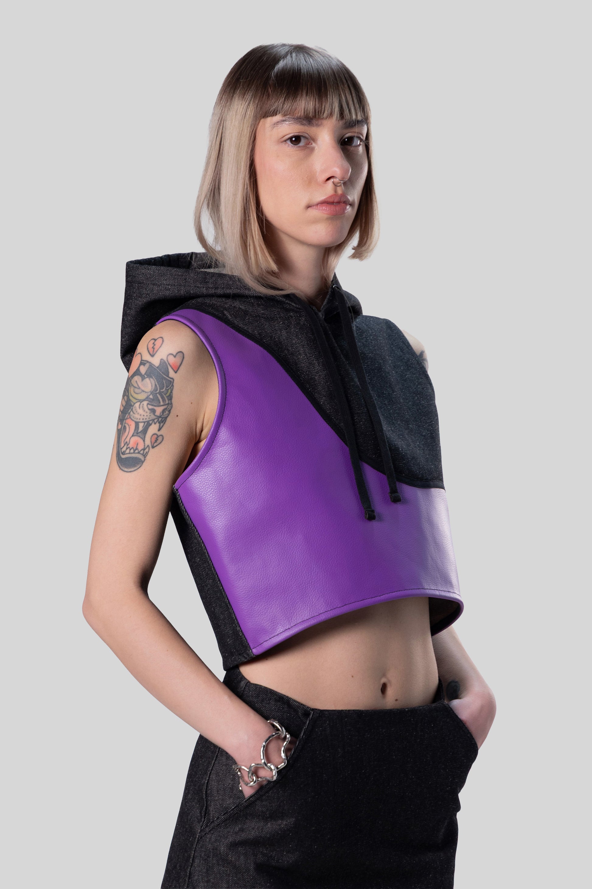 Angled portrait of Venom hood showing sleeveless cropped silhouette